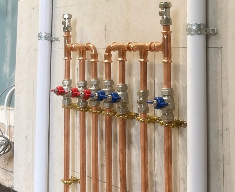 Copper manifold installed by Tidemark Plumbing